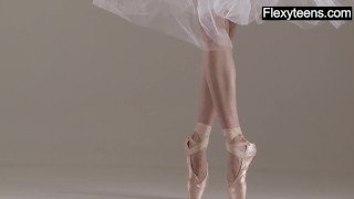 Blonde gymnast performs gymnastics