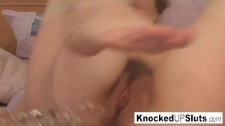 Pregnant brunette in glasses toys both her holes